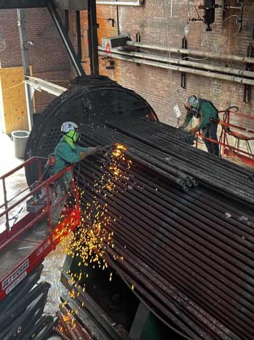 demolition workers cutting metal