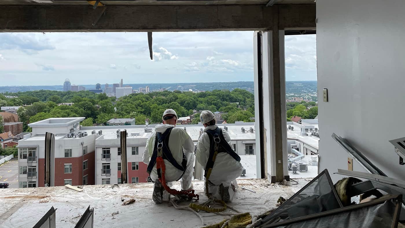 Workers conducting hazardous material abatement in a building