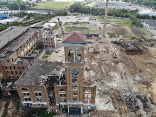 demolition in progress for a building and clocktower